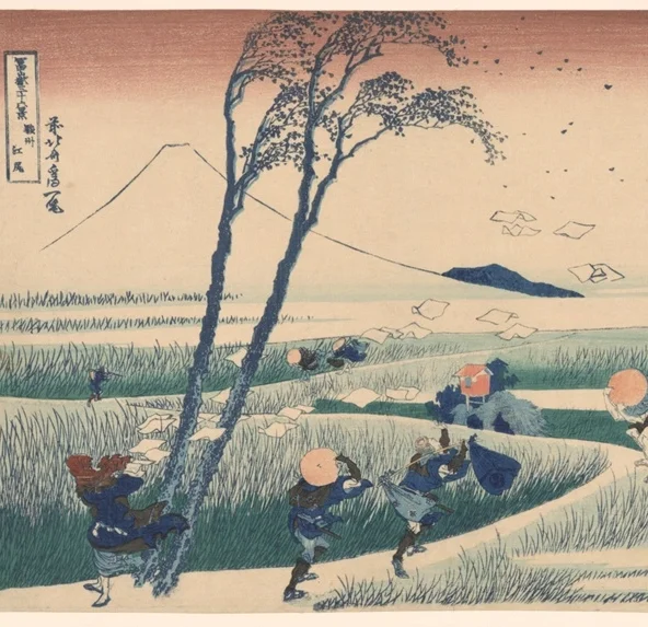 風に煽られる二本の木