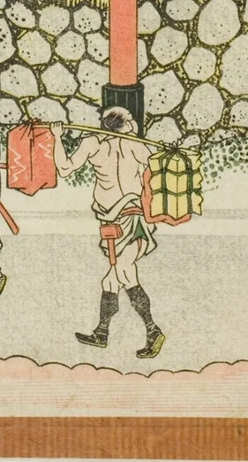 荷物を運ぶ人足