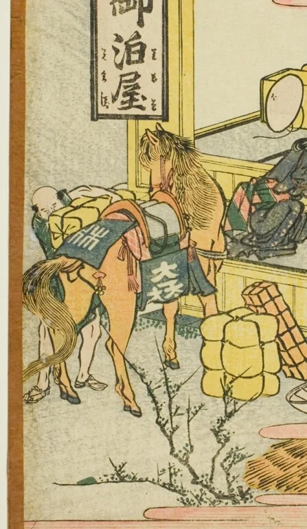 荷物を積んだ茶色の馬