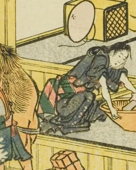 青い着物の働く女性