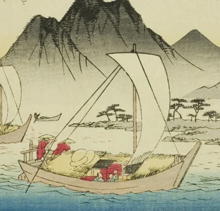 White sail of the foreground boat