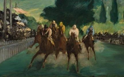 正面から迫り来る競走馬の群れ