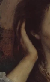 髪に触れる右手