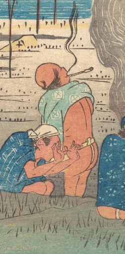 煙管をくゆらす男