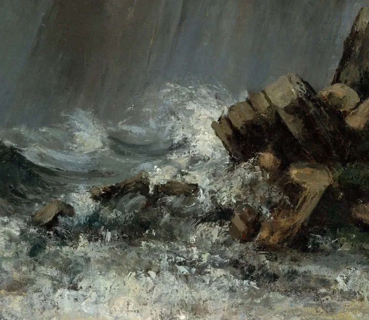 wave spray crashing on rocks